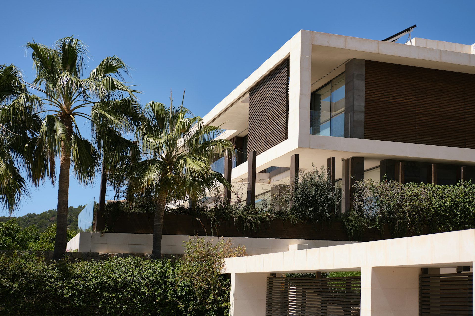 White residential home surrounded by trees